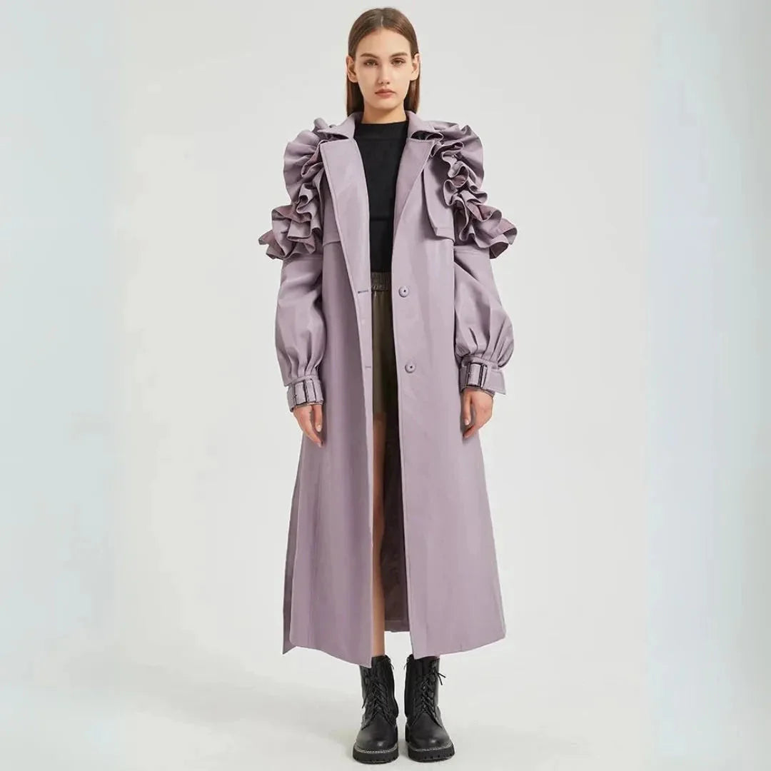 Women's black faux leather trench coat dramatic ruffled sleeves cinched belt long tailored silhouette