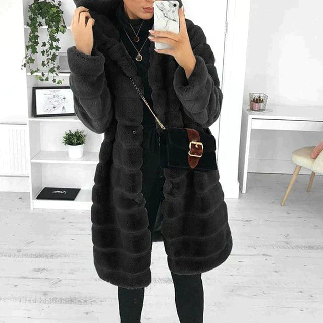 Women's elegant white faux fur button-down coat with plush texture and luxe semi-formal style