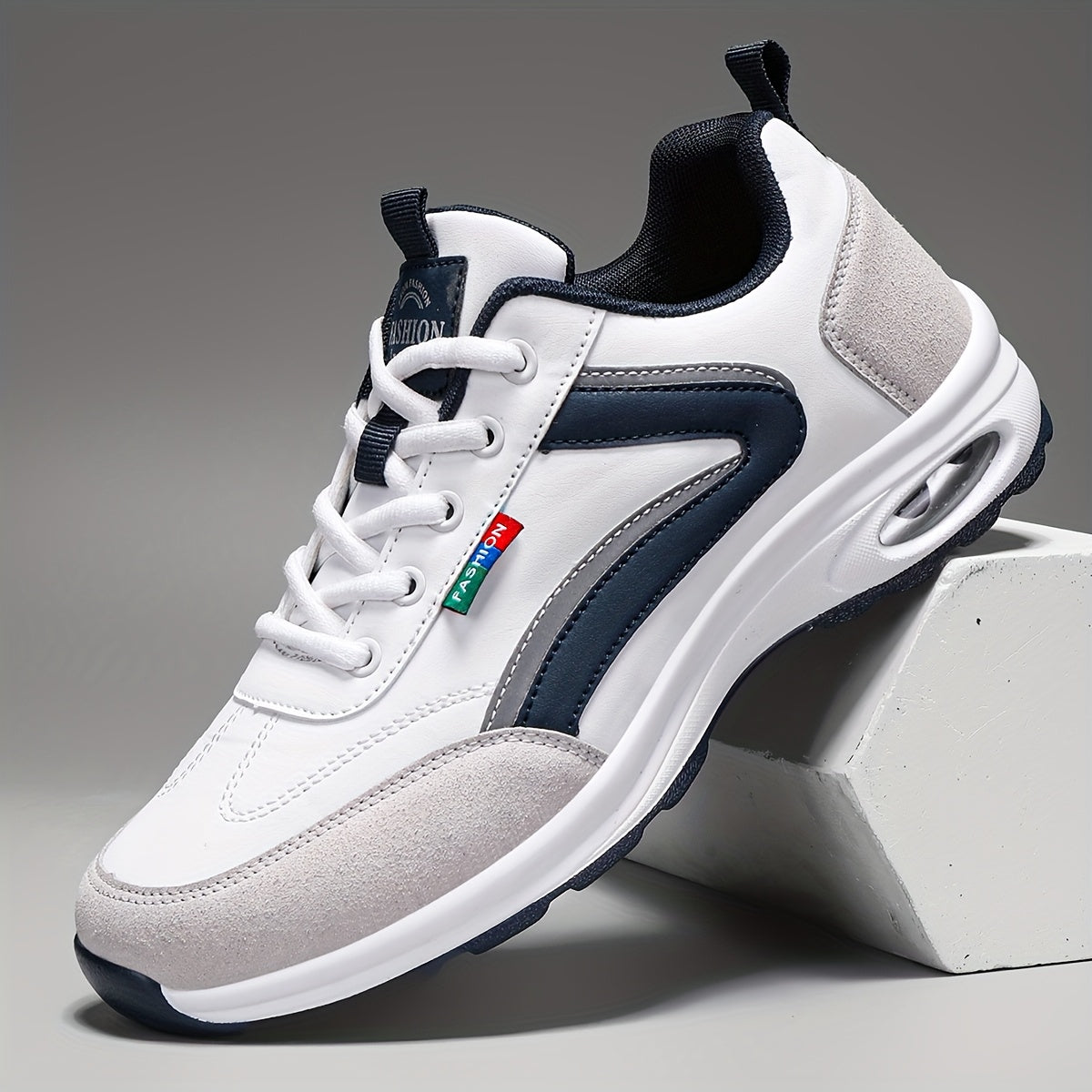 Men's white ergonomic sneakers with breathable upper and targeted arch support for active daily comfort