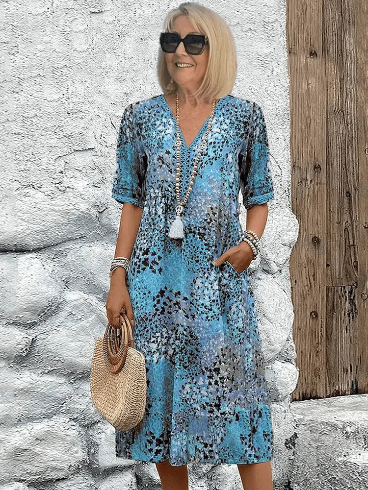 Women's floral midi dress breezy relaxed silhouette in delicate print perfect for summer elegance