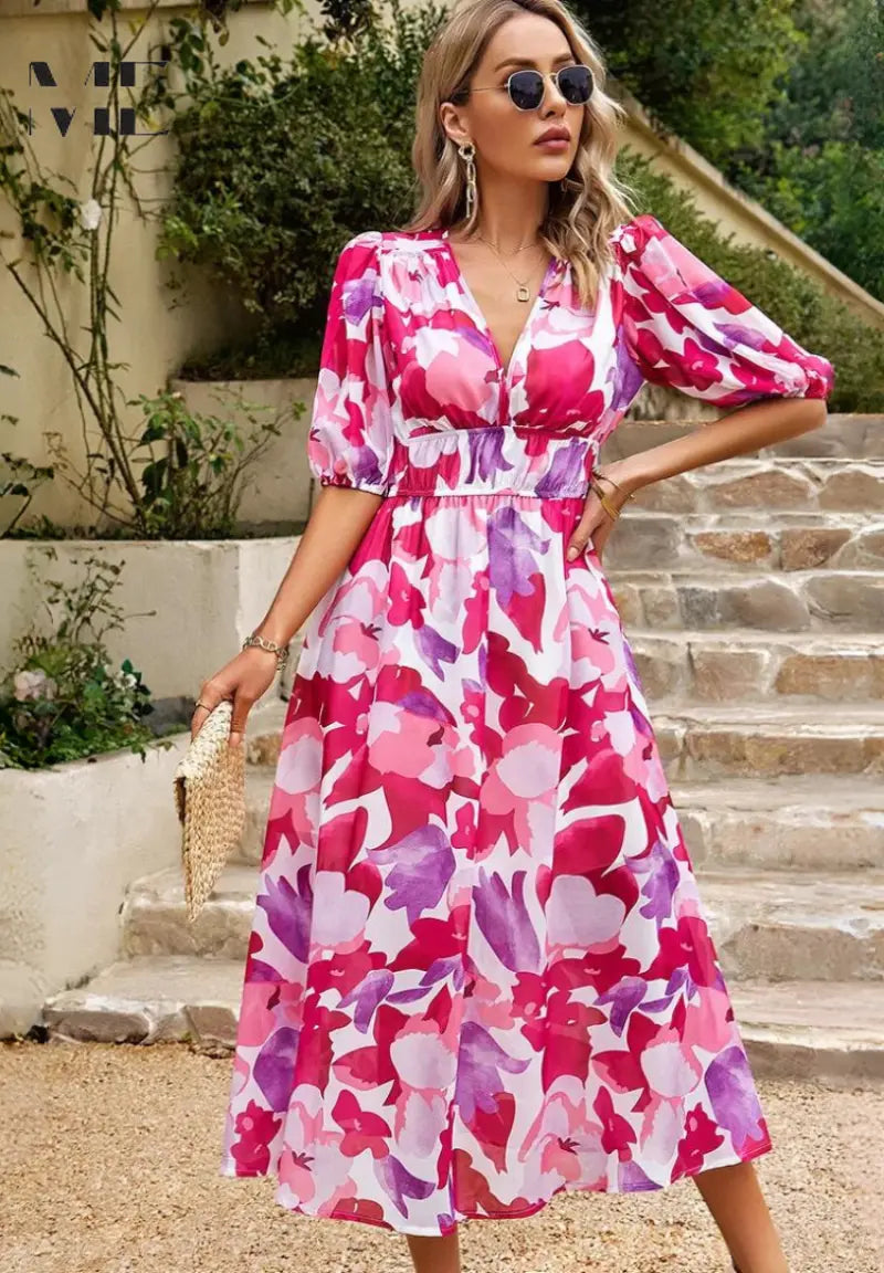 Women's floral midi dress with vibrant print, puff sleeves, and flowing silhouette for elegant style