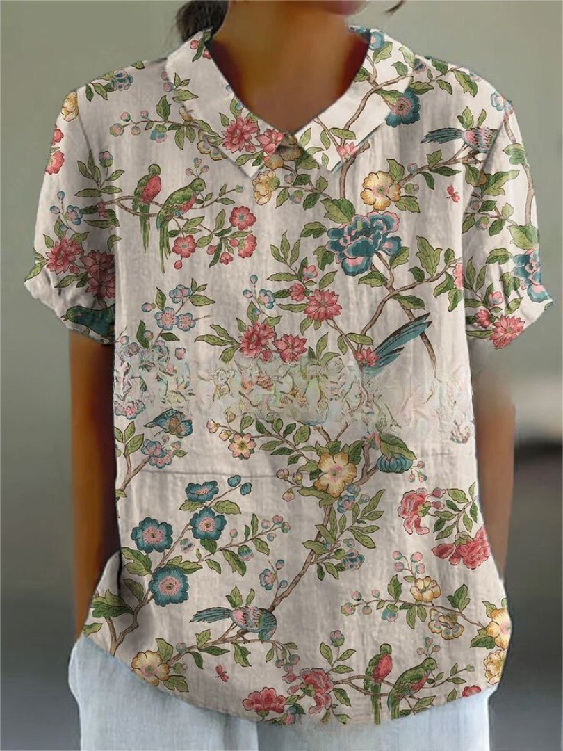 Women's white collared short sleeve blouse relaxed fit with gathered sleeves and curved hem
