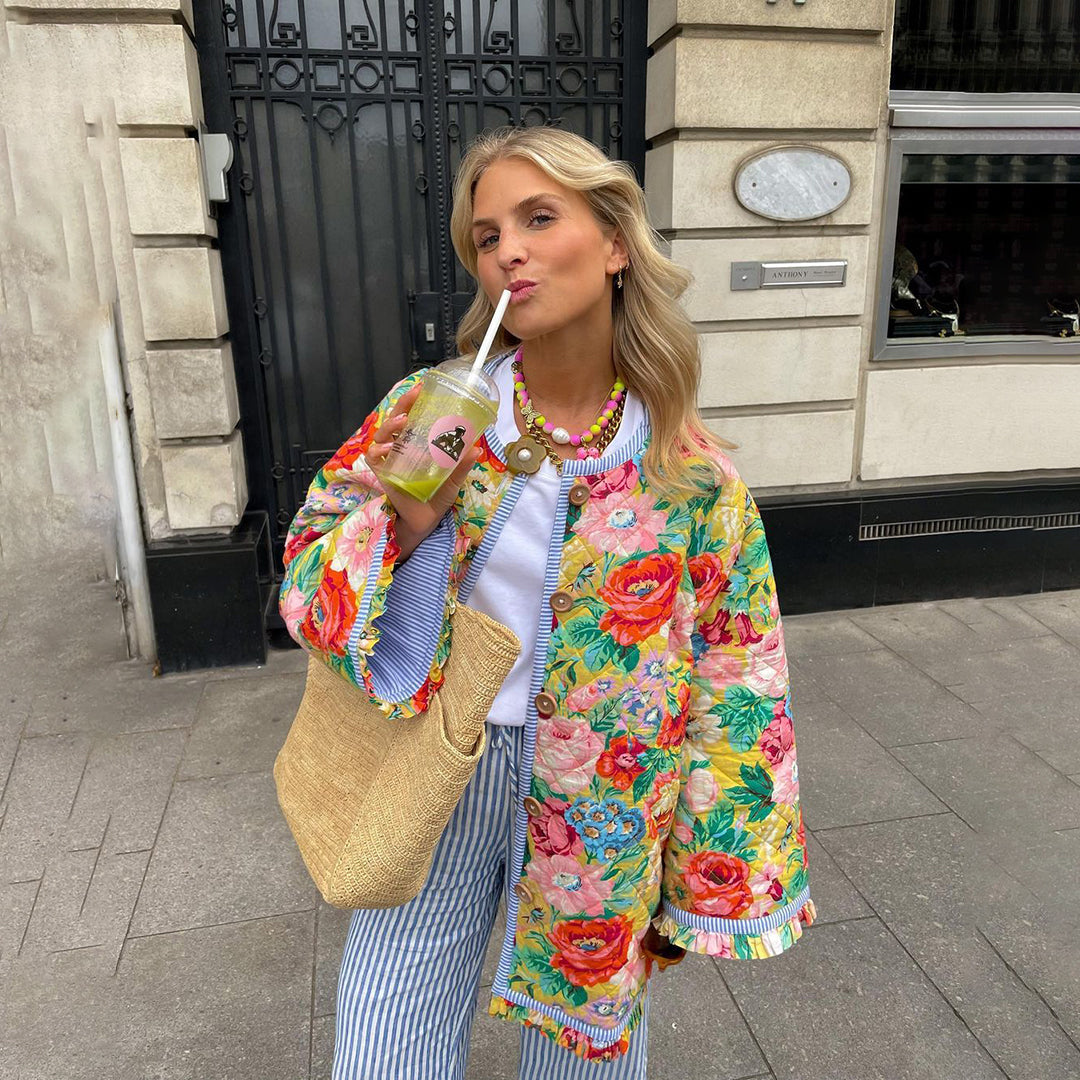Women's vintage oversized quilted floral patchwork jacket with padded comfort and bold applique detail