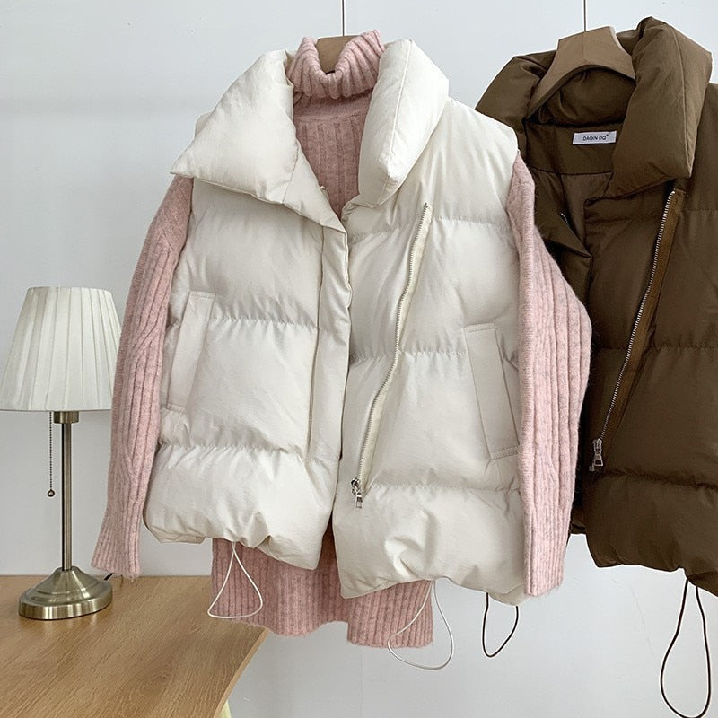 Black quilted padded vest with high collar, unisex sleek silhouette for everyday warmth