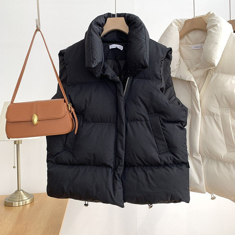Black quilted padded vest high collar unisex sleeveless insulated contemporary silhouette