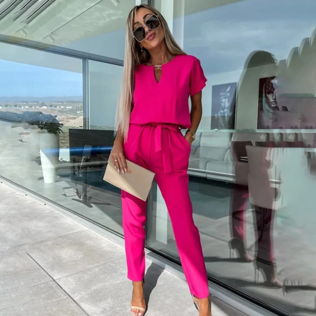Women's cotton-blend jumpsuit elastic waist flattering silhouette versatile chic one-piece day-to-night