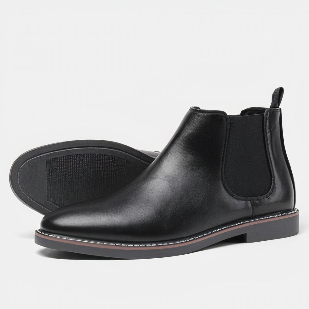 Men's black full-grain leather Chelsea boots with elastic side panels and sleek timeless silhouette