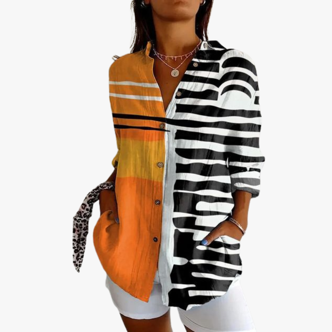 Women's white linen blouse with handcrafted embroidery, relaxed fit, timeless artisanal elegance
