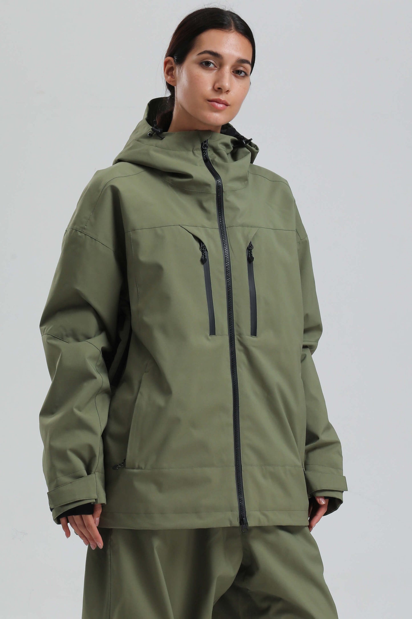 Women's black oversized insulated snow jacket with dual vents, sealed YKK zippers, and multi-pocket design