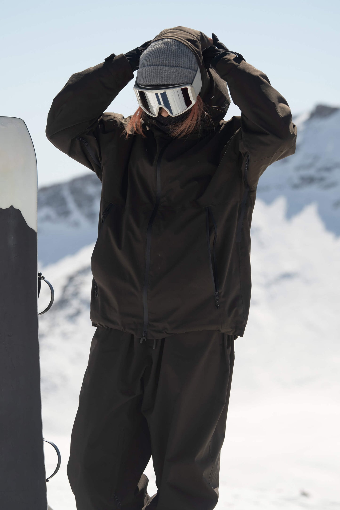 Women's light grey oversized insulated snow jacket with dual underarm vents and 15K waterproof sealed shell