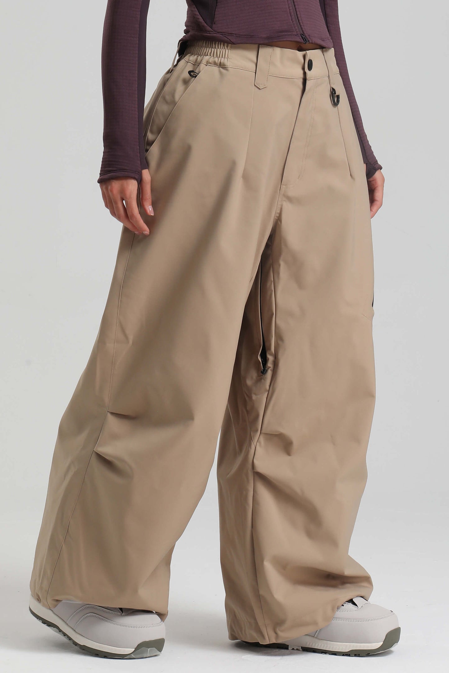 Women's ice blue lightweight baggy snow pants waterproof breathable with inner thigh vents for skiers