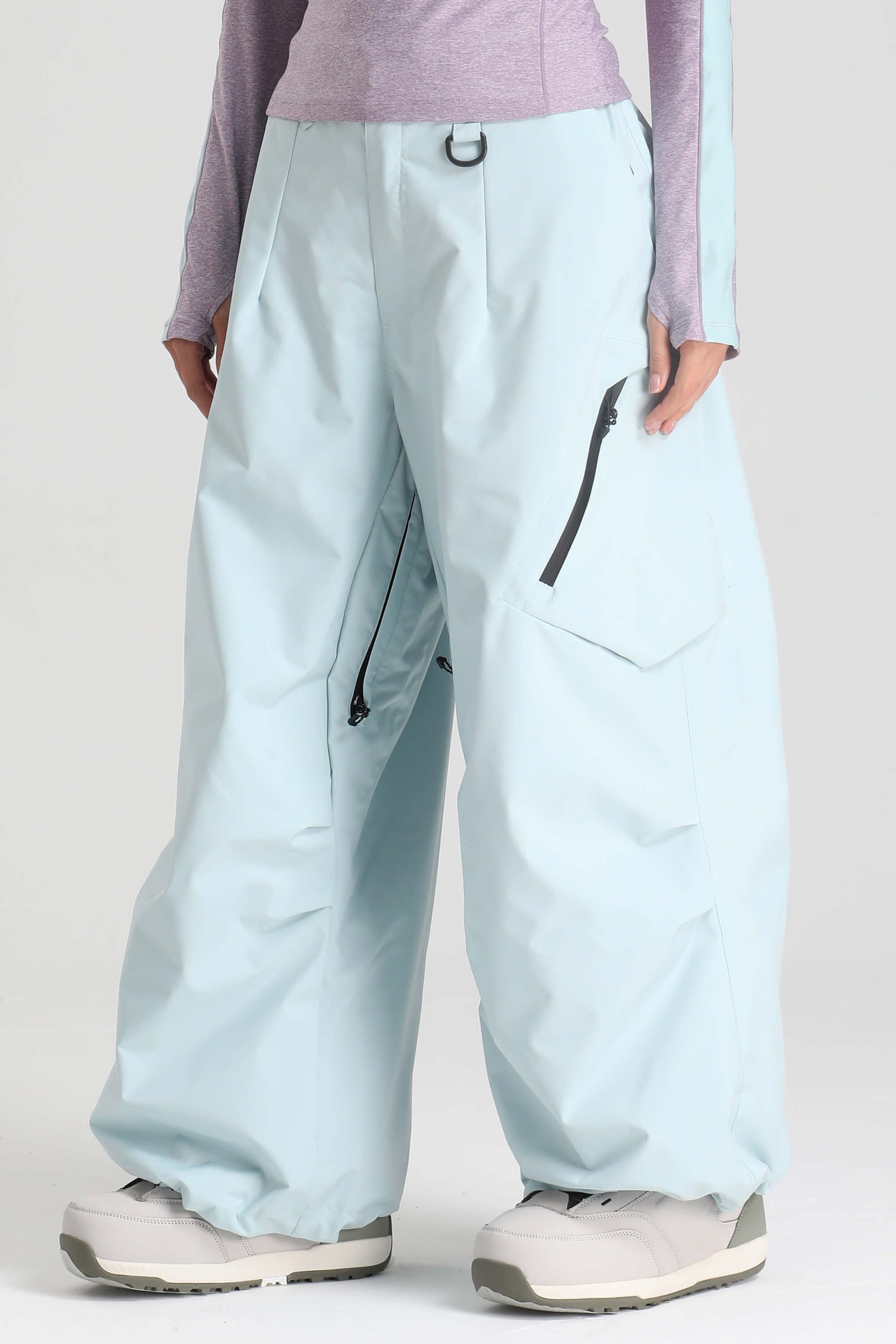 Women's light gray baggy snow pants with zippered thigh vents for skiing and snowboarding