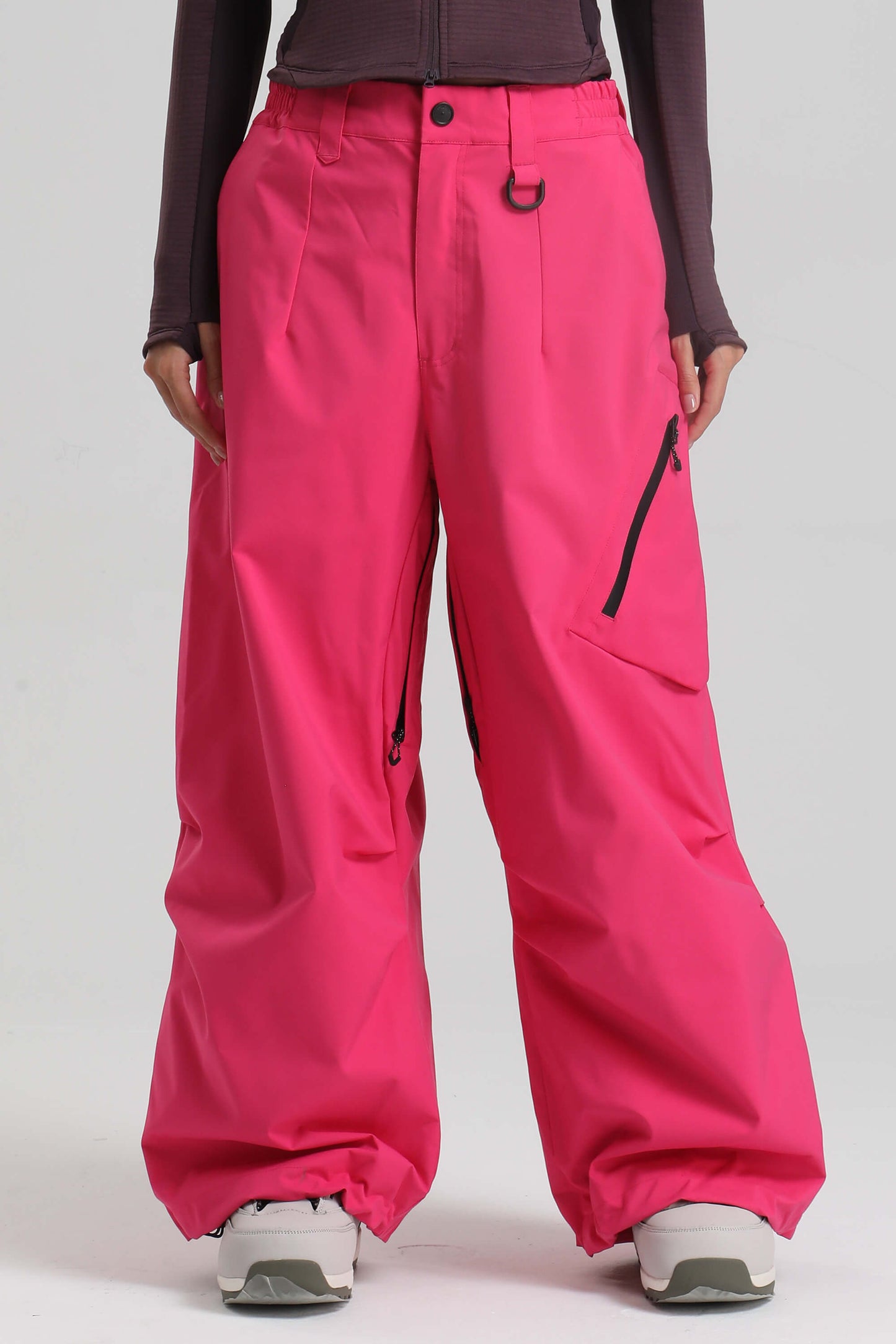 Women's light gray baggy snow pants with zippered thigh vents for skiing and snowboarding