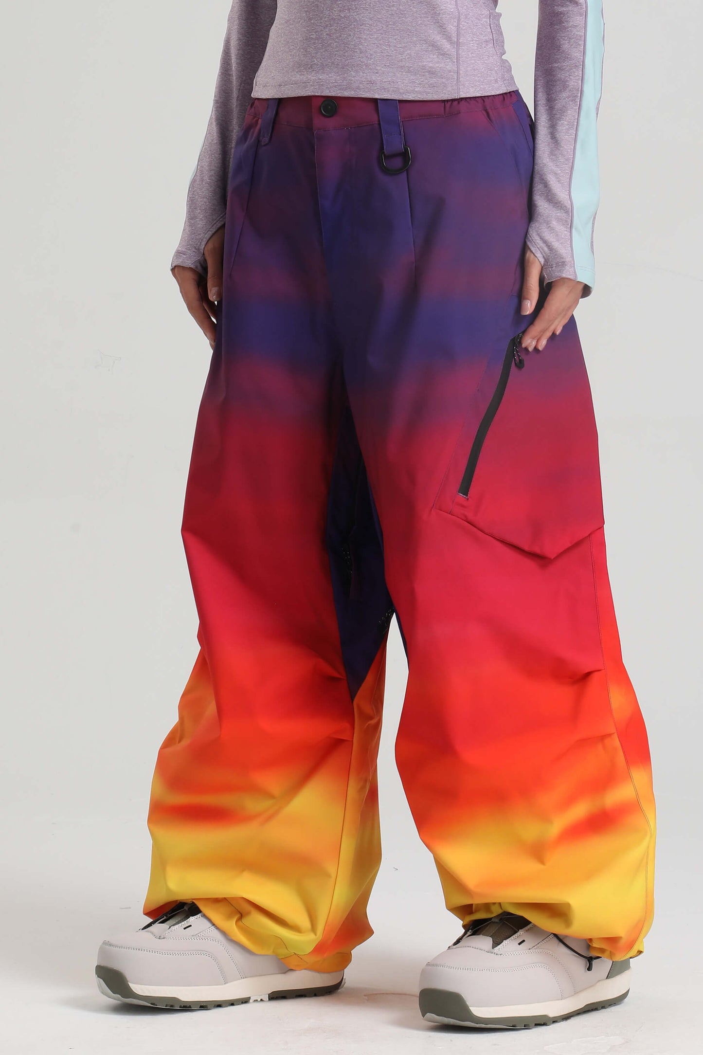 Women's light gray baggy snow pants with zippered thigh vents for skiing and snowboarding
