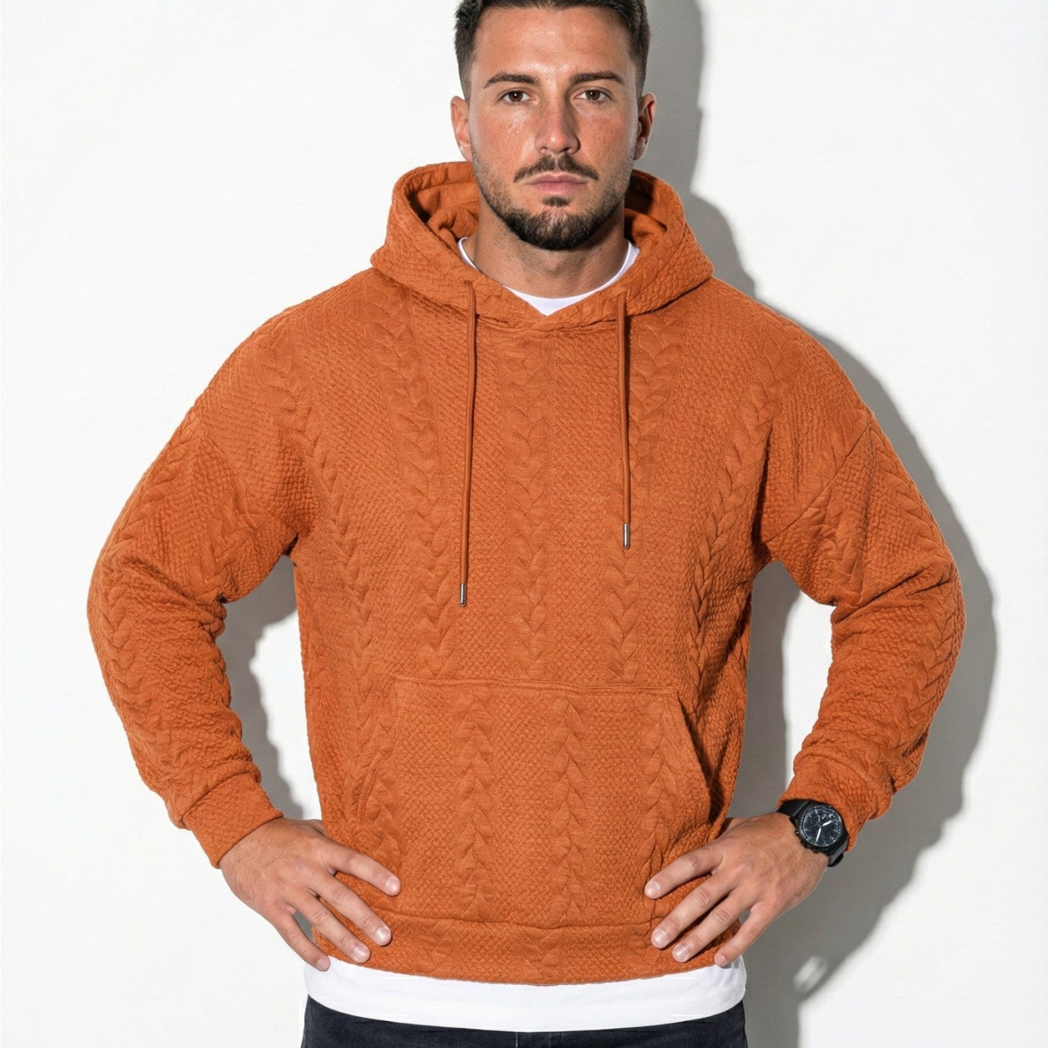 Men's oversized black knit hoodie with drawstring hood, relaxed urban streetwear silhouette