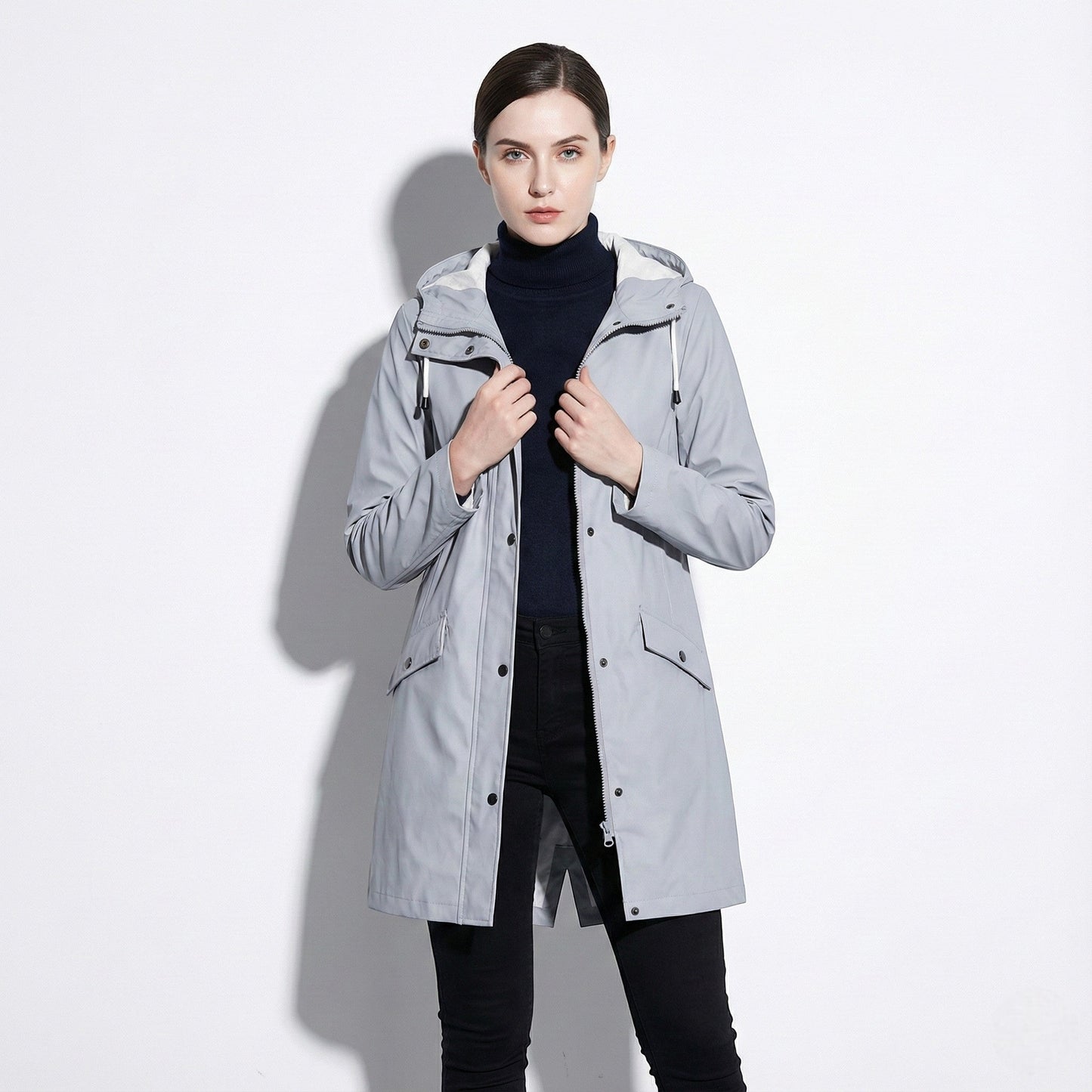 Women's mid-length water-repellent jacket with drawstring hood, sleek urban silhouette for professionals