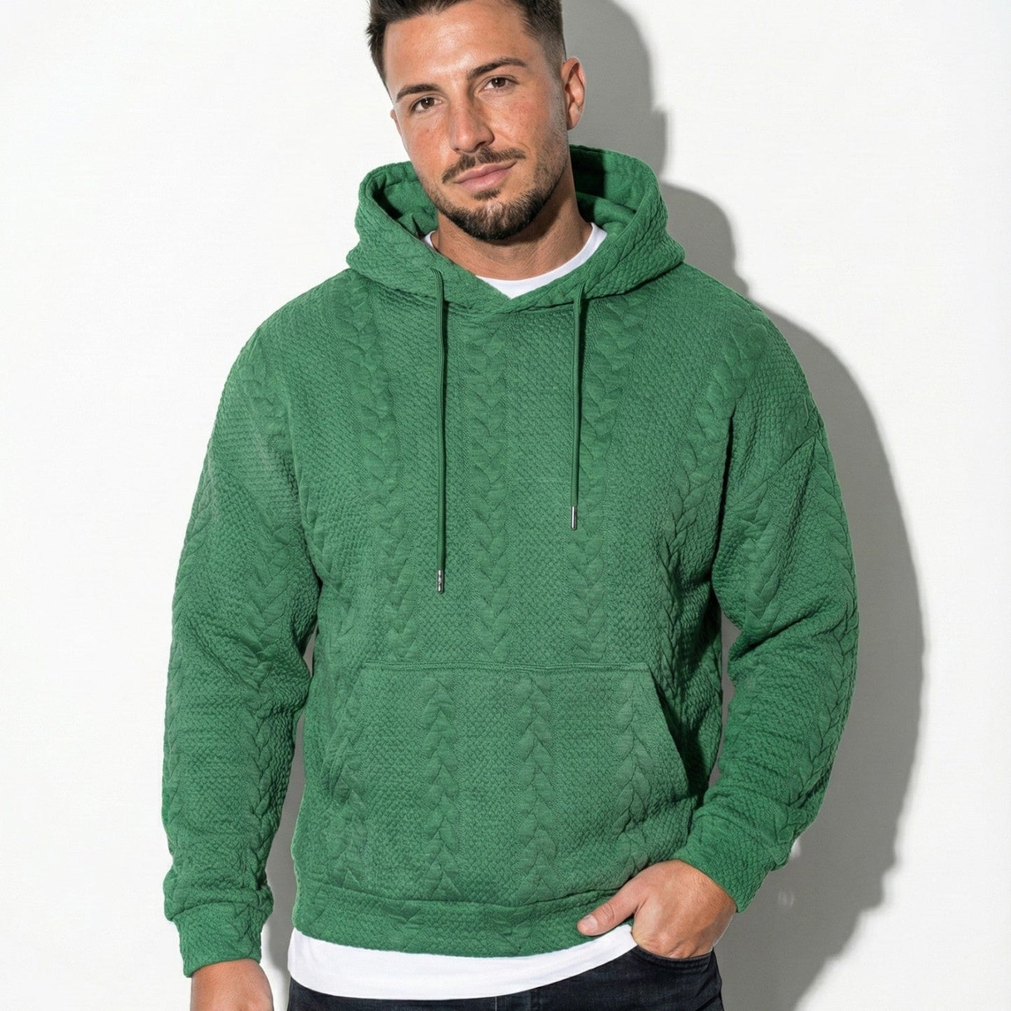 Men's oversized black knit hoodie with drawstring hood, relaxed urban streetwear silhouette