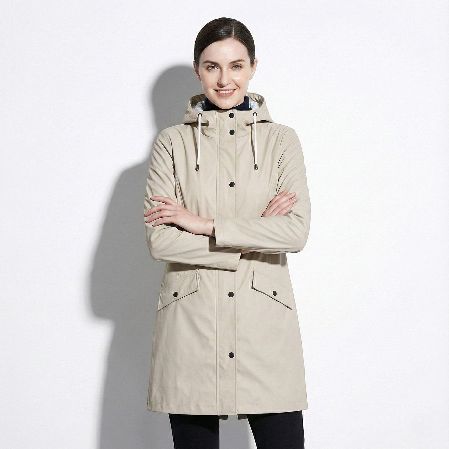 Women's mid-length water-repellent jacket with drawstring hood, sleek urban silhouette