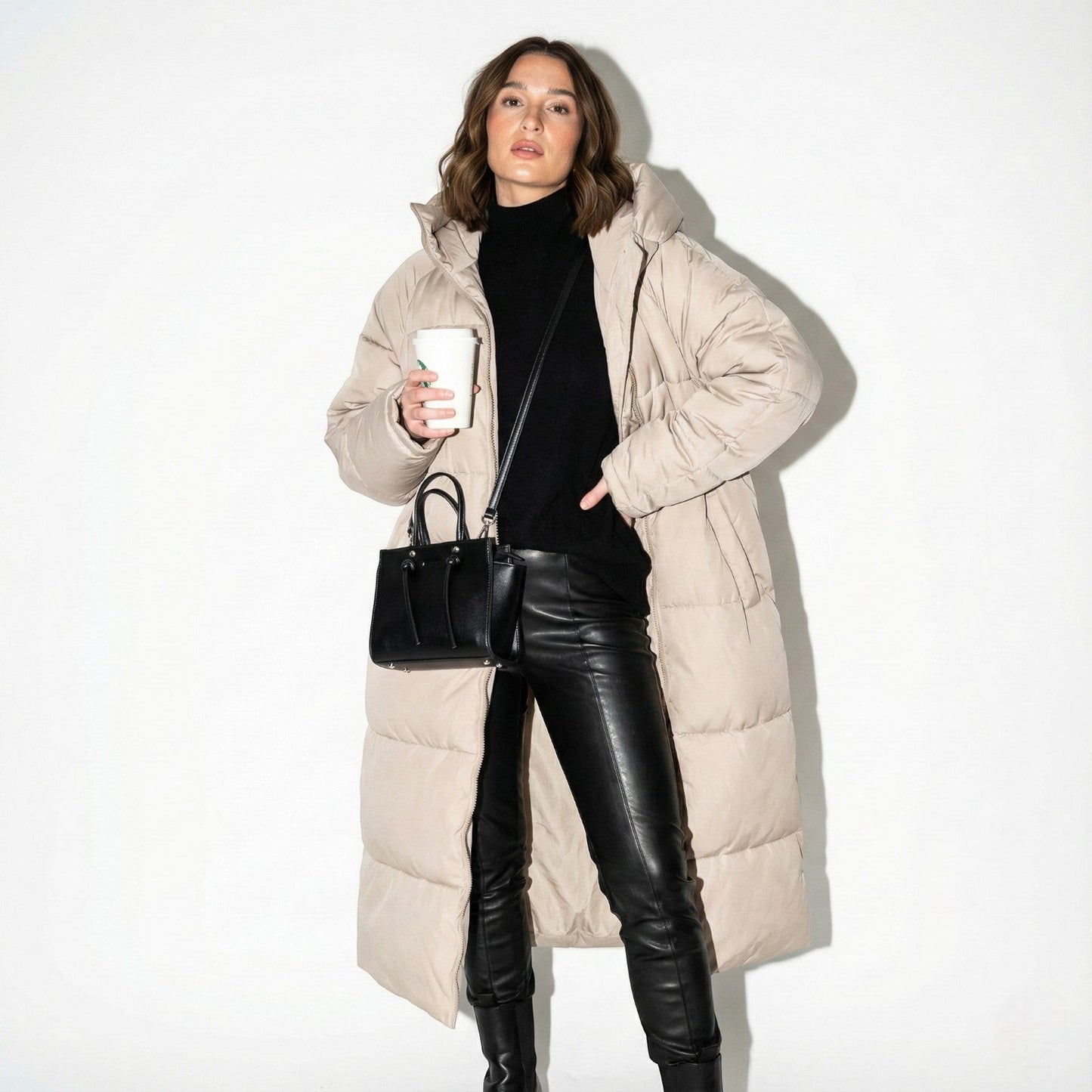 Women's midnight black longline puffer jacket with hood, water-repellent shimmer fabric, tailored silhouette