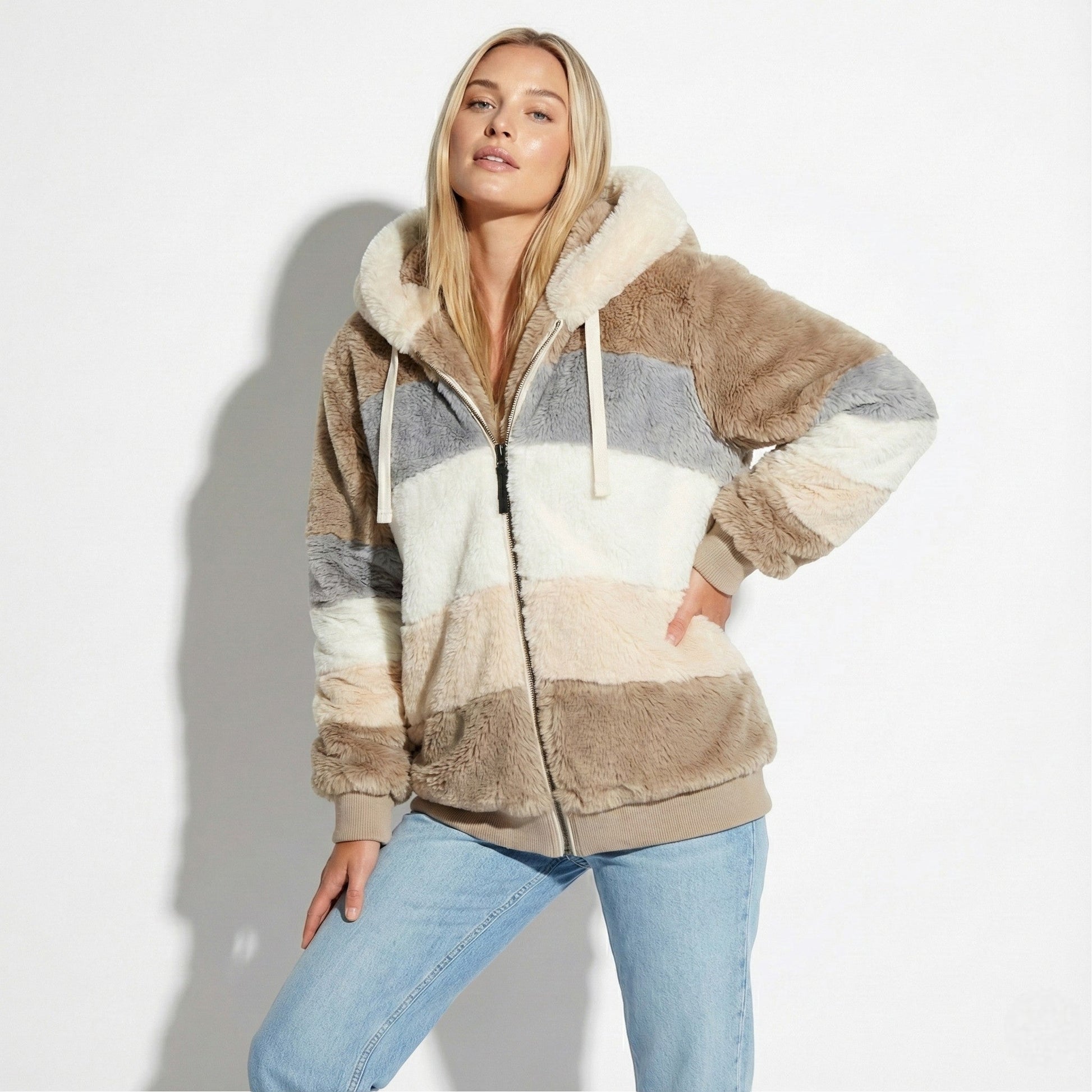 Women's oversized faux fur hooded jacket in neutral tone, relaxed urban silhouette with integrated hood