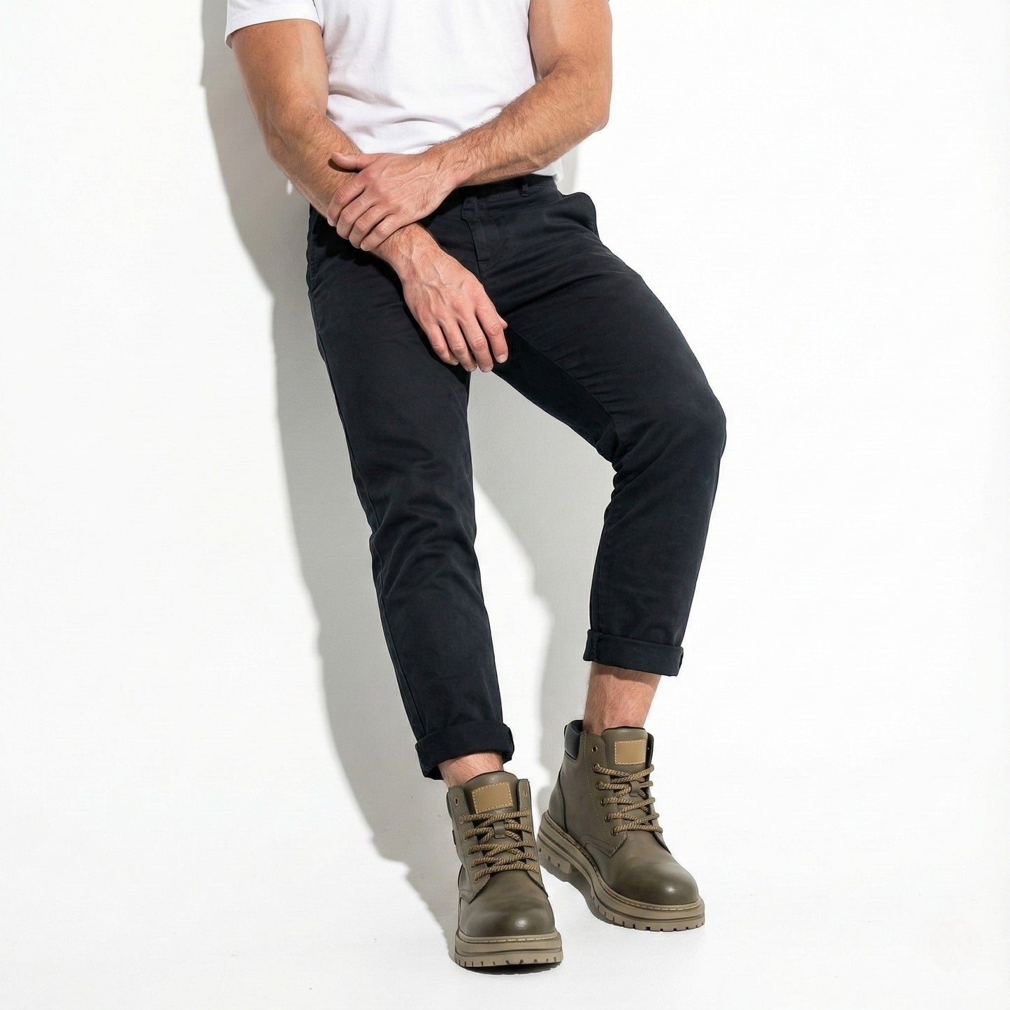 Men's black leather combat boots with chunky lug sole, ankle buckle, and non-slip rubber outsole