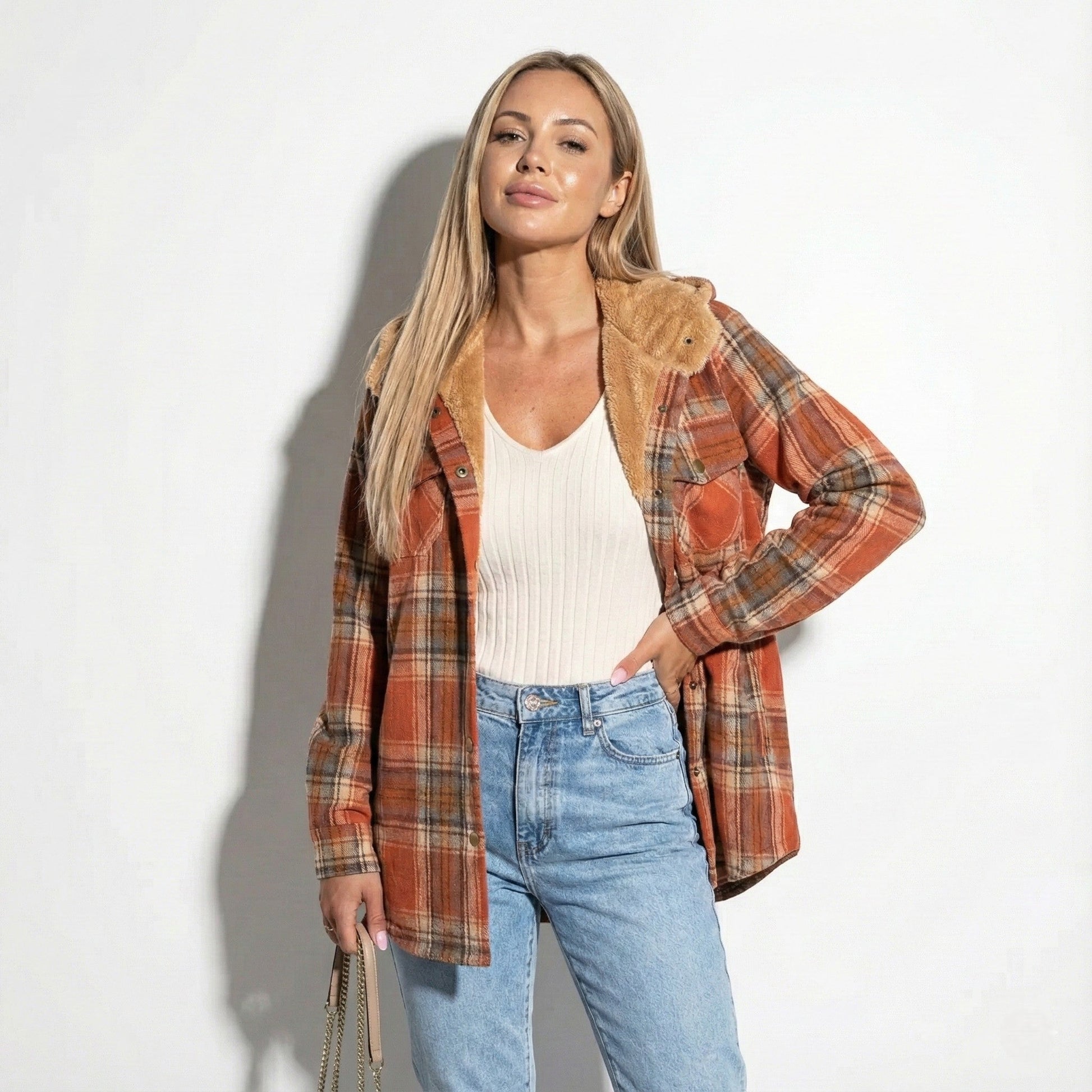 Women's plaid overshirt jacket with soft sherpa lining, casual chic earth-tone check design