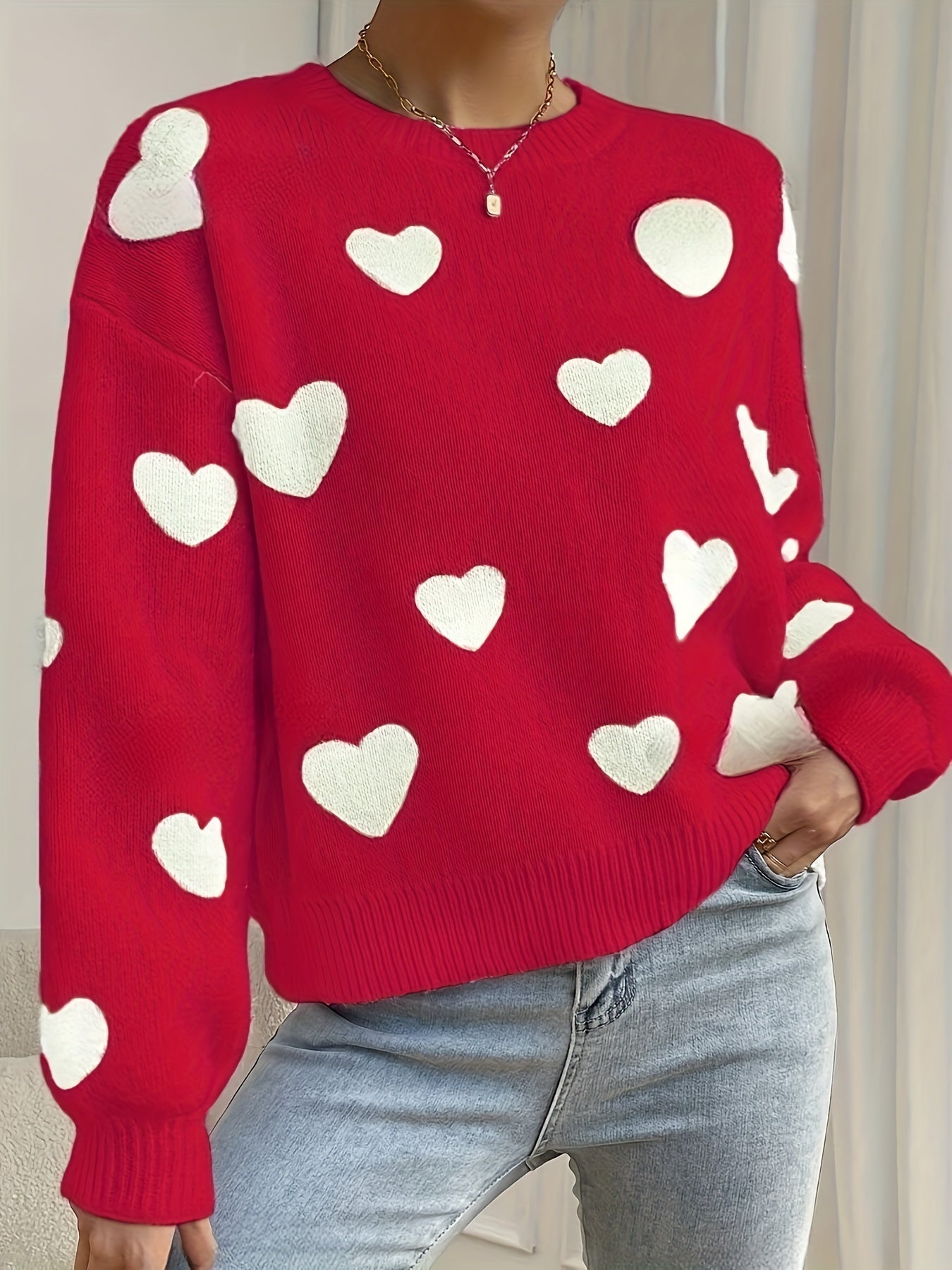 Women's cozy knit sweater in warm tones with playful heart design, soft stretchy fit for autumn winter