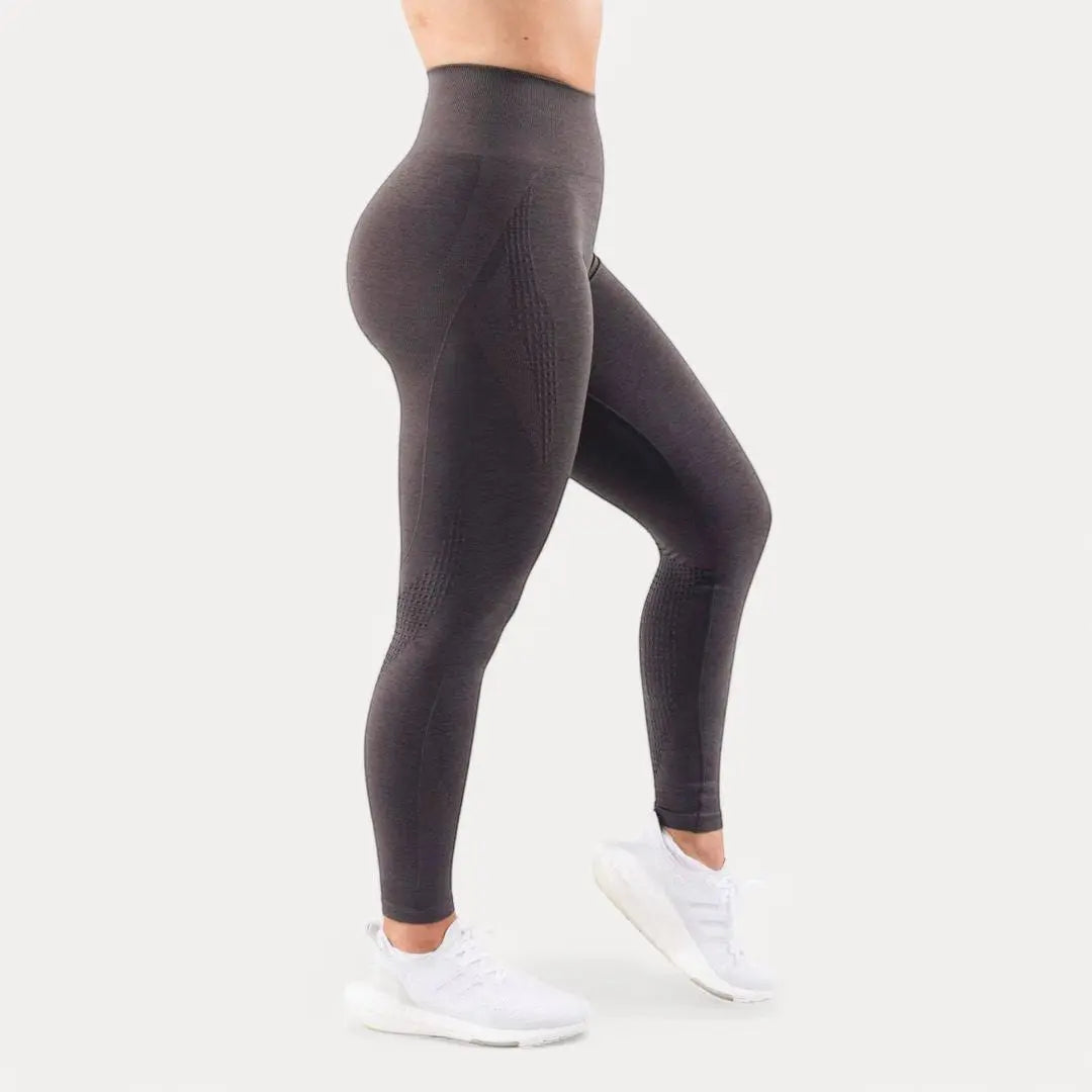 Women's black seamless high-waist sculpting leggings with breathable stretch fabric for yoga workouts