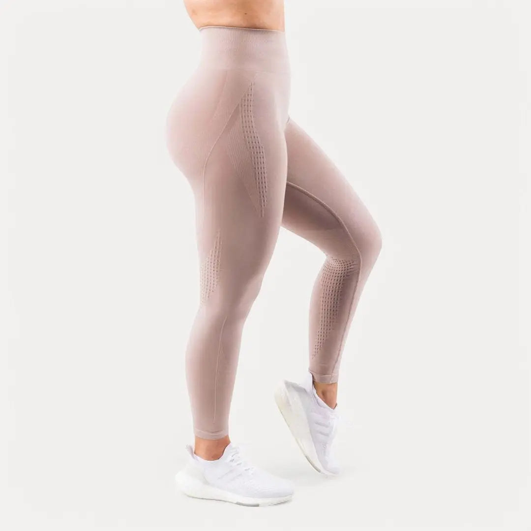 Women's black seamless high-waist sculpting leggings with contour fit for yoga and workouts