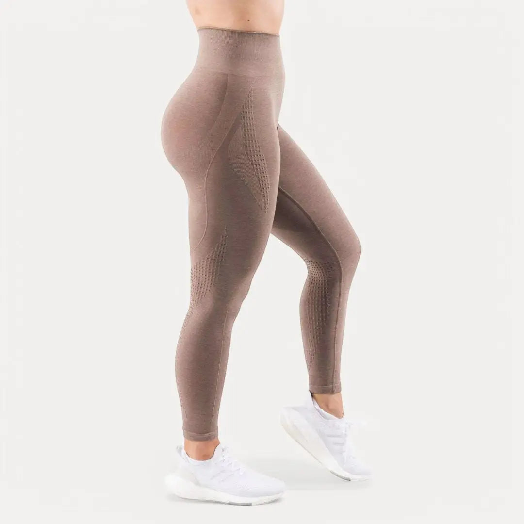 Women's black seamless high-waist sculpting leggings with contour fit for yoga and workouts