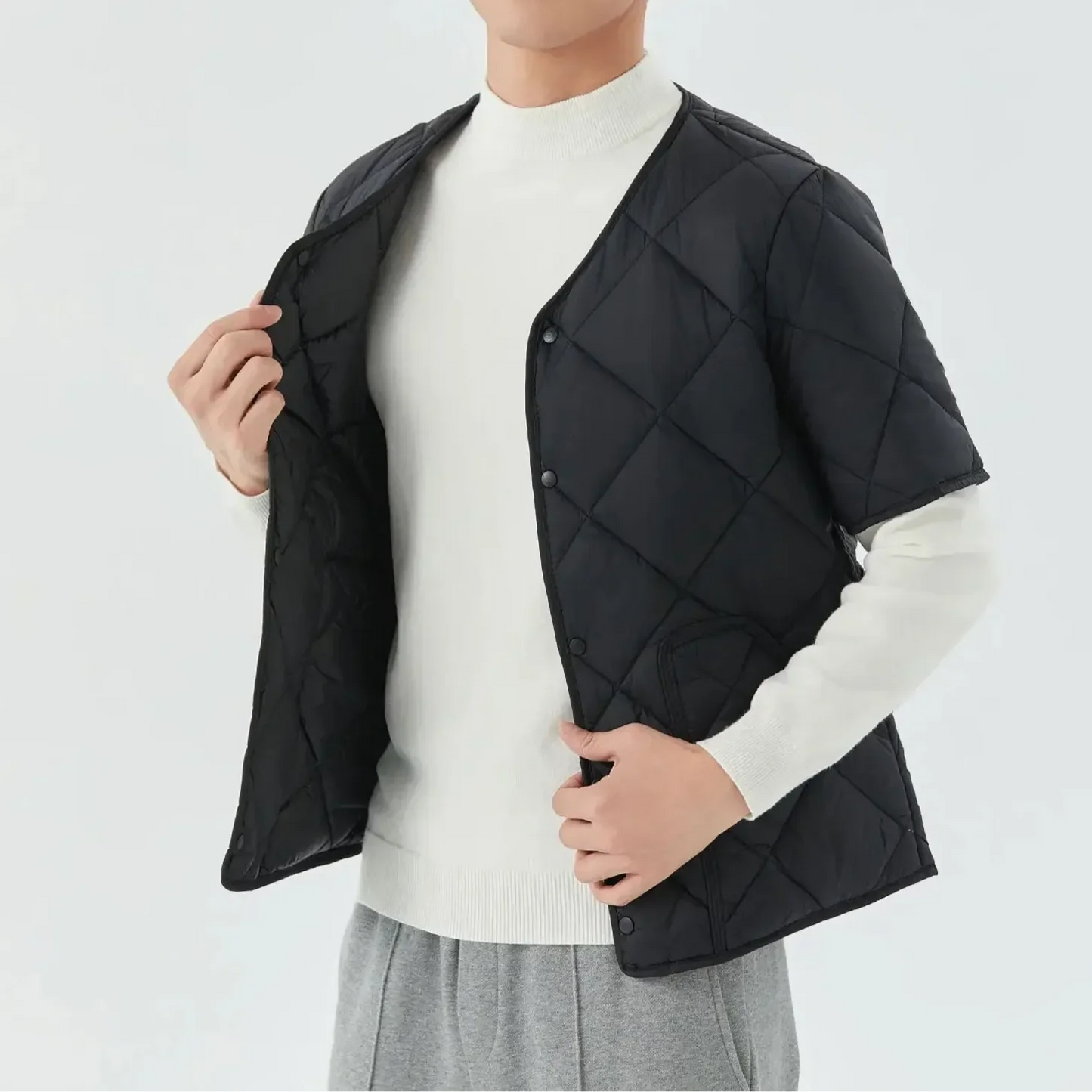 Unisex quilted vest with cozy fleece lining, lightweight structured shell, versatile layering essential