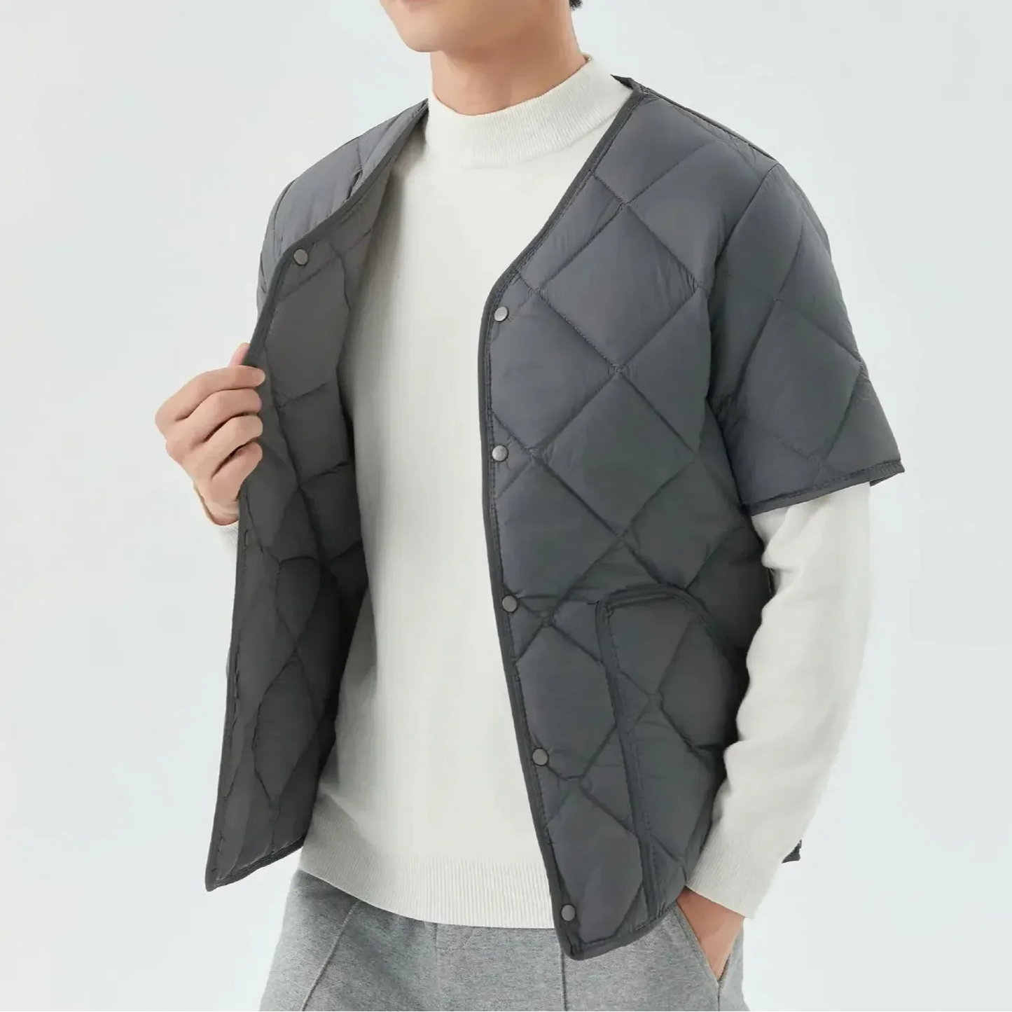 Unisex quilted vest with cozy fleece lining, lightweight structured shell, versatile layering essential