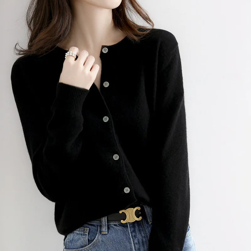 Women's fitted cashmere button cardigan in soft neutral tone with classic round neckline