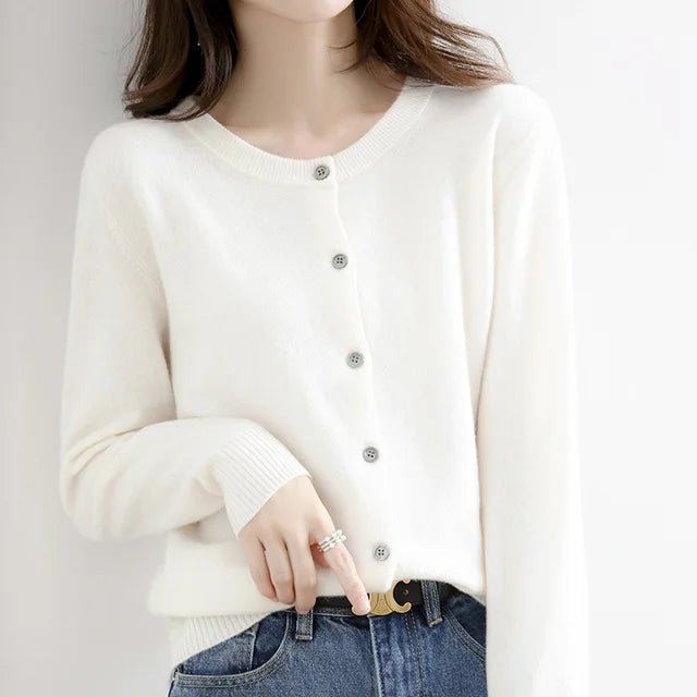 Women's fitted cashmere button cardigan in soft neutral tone with classic round neckline