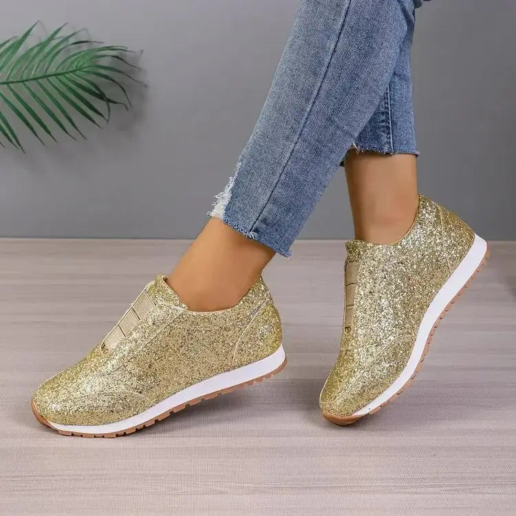 Women's glitter slip-on sneakers with elastic fit, cushioned sole, and sparkling textured grip