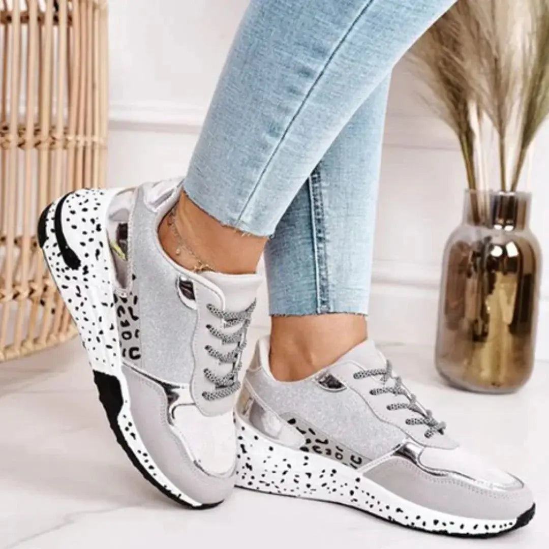 Women's chunky cushioned sneakers with glitter finish, metallic accents, and glamorous sparkling details