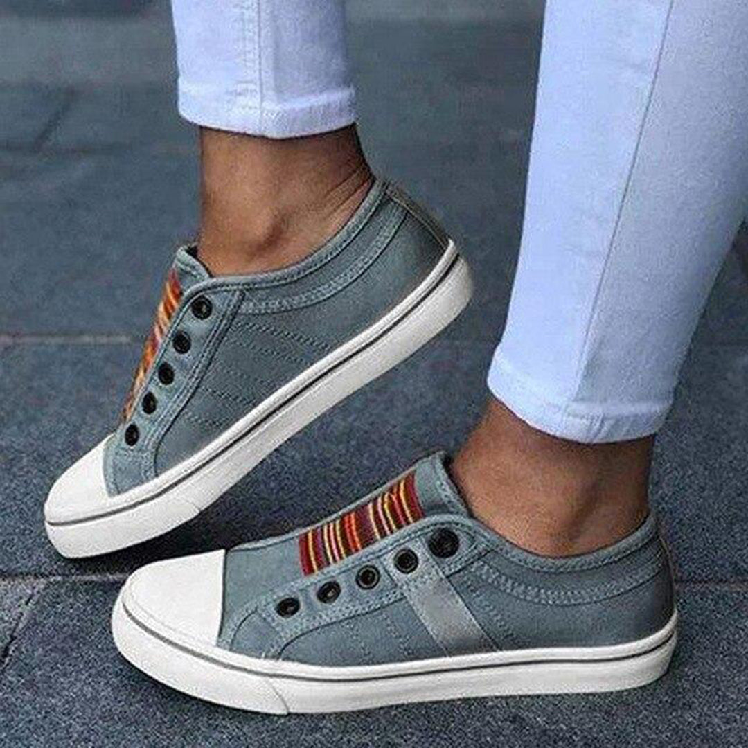 Women's slip-on sneakers with vibrant multicolor stripes, laceless casual style, padded insole comfort