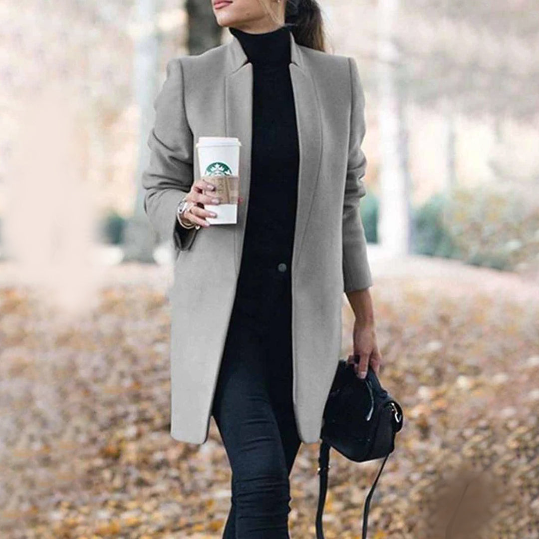Women's classic tailored winter coat structured fit sharp lapels professional elegant silhouette