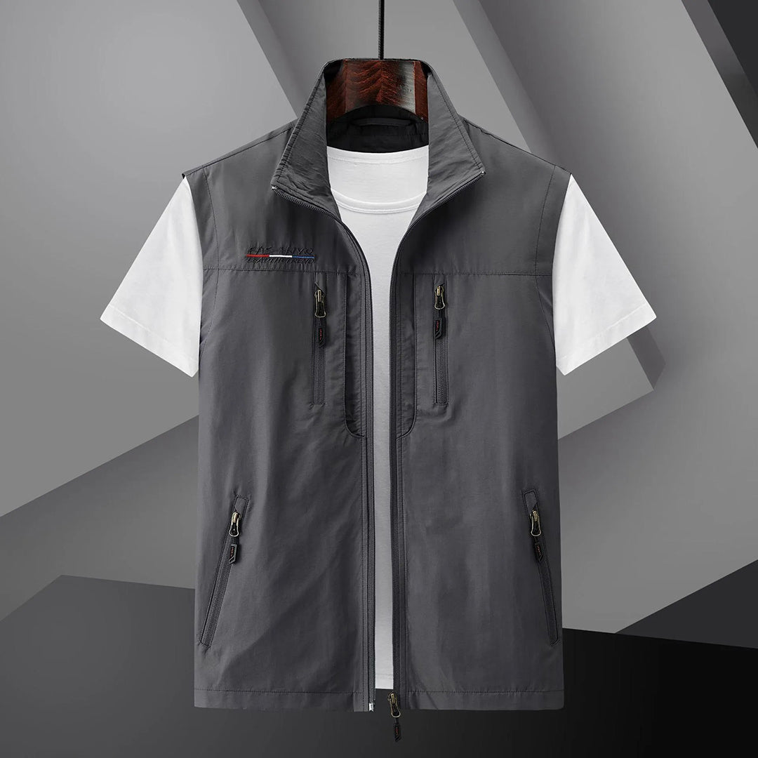 Men's lightweight utility vest with multiple pockets, classic outdoor style in neutral travel-ready design