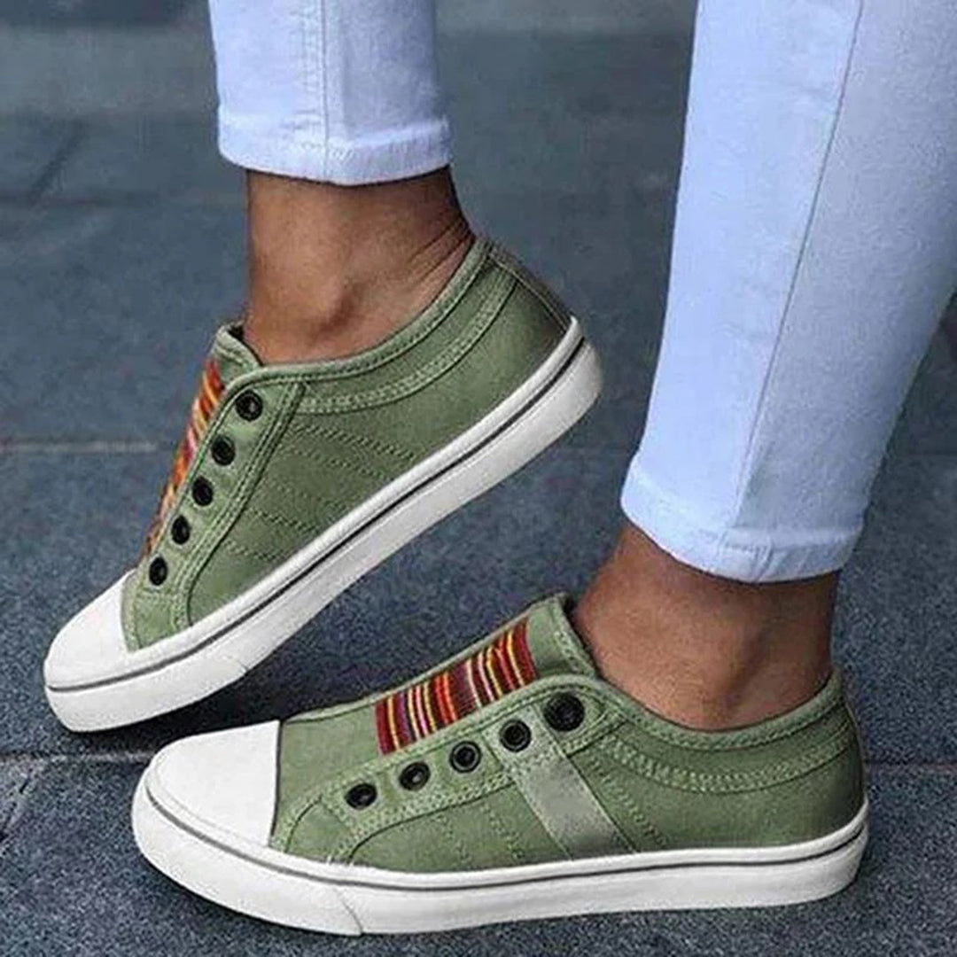 Women's slip-on sneakers with vibrant multicolor stripes, laceless casual style, padded insole comfort