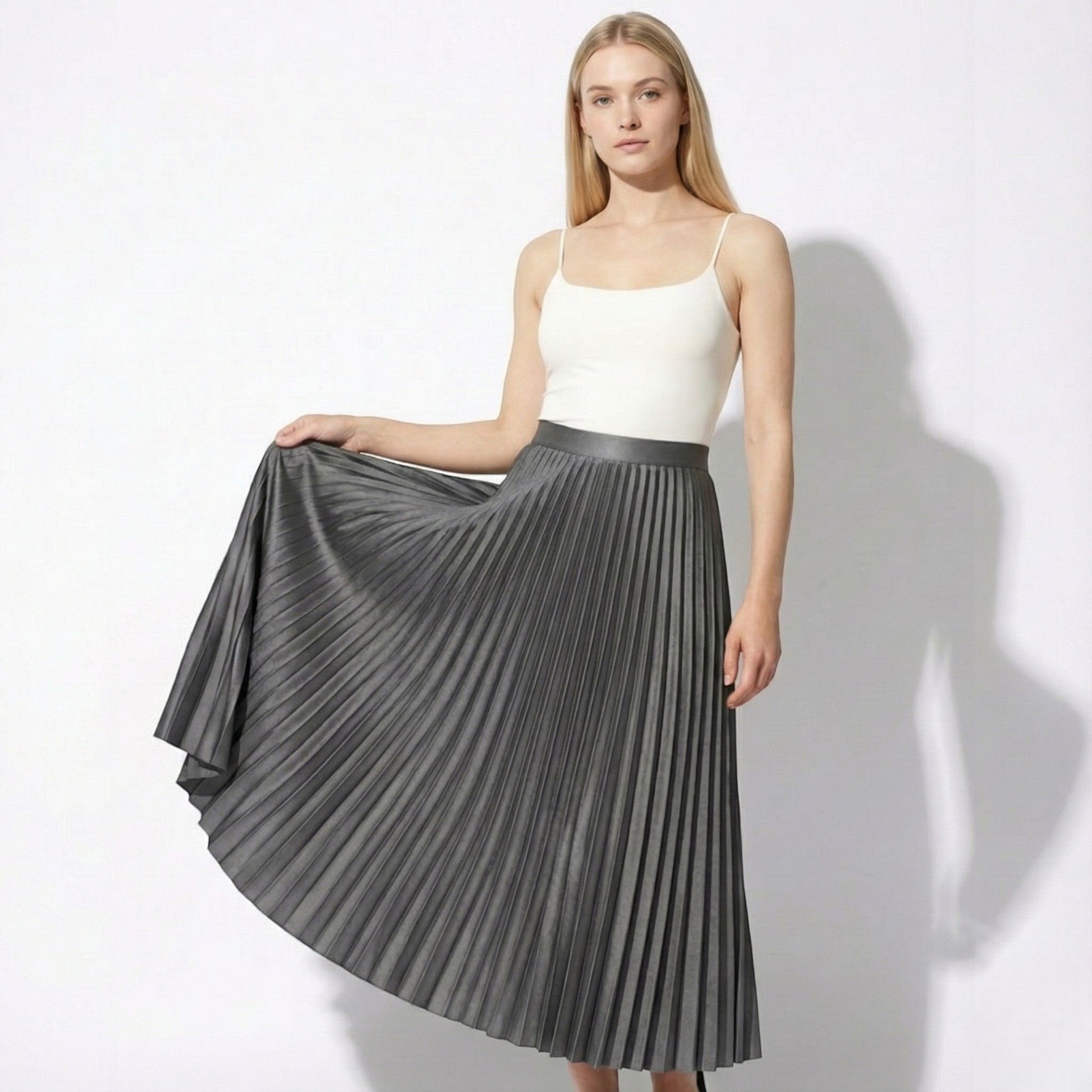 Women's high-waisted pleated satin skirt in neutral tone with graceful drape for office or casual wear