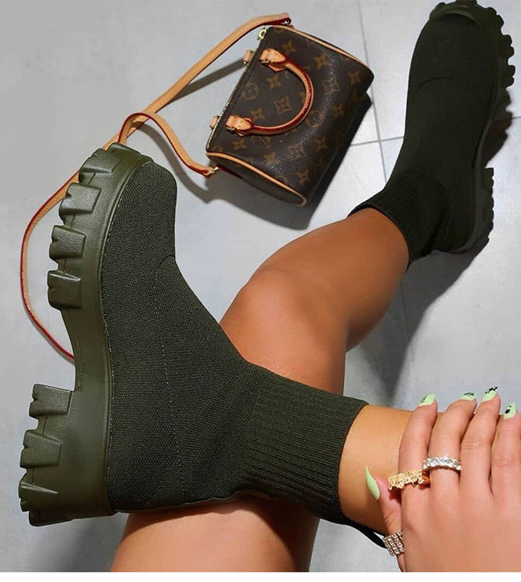 Women's slip-on chunky heel boots with stretch upper and lug sole for bold casual city style