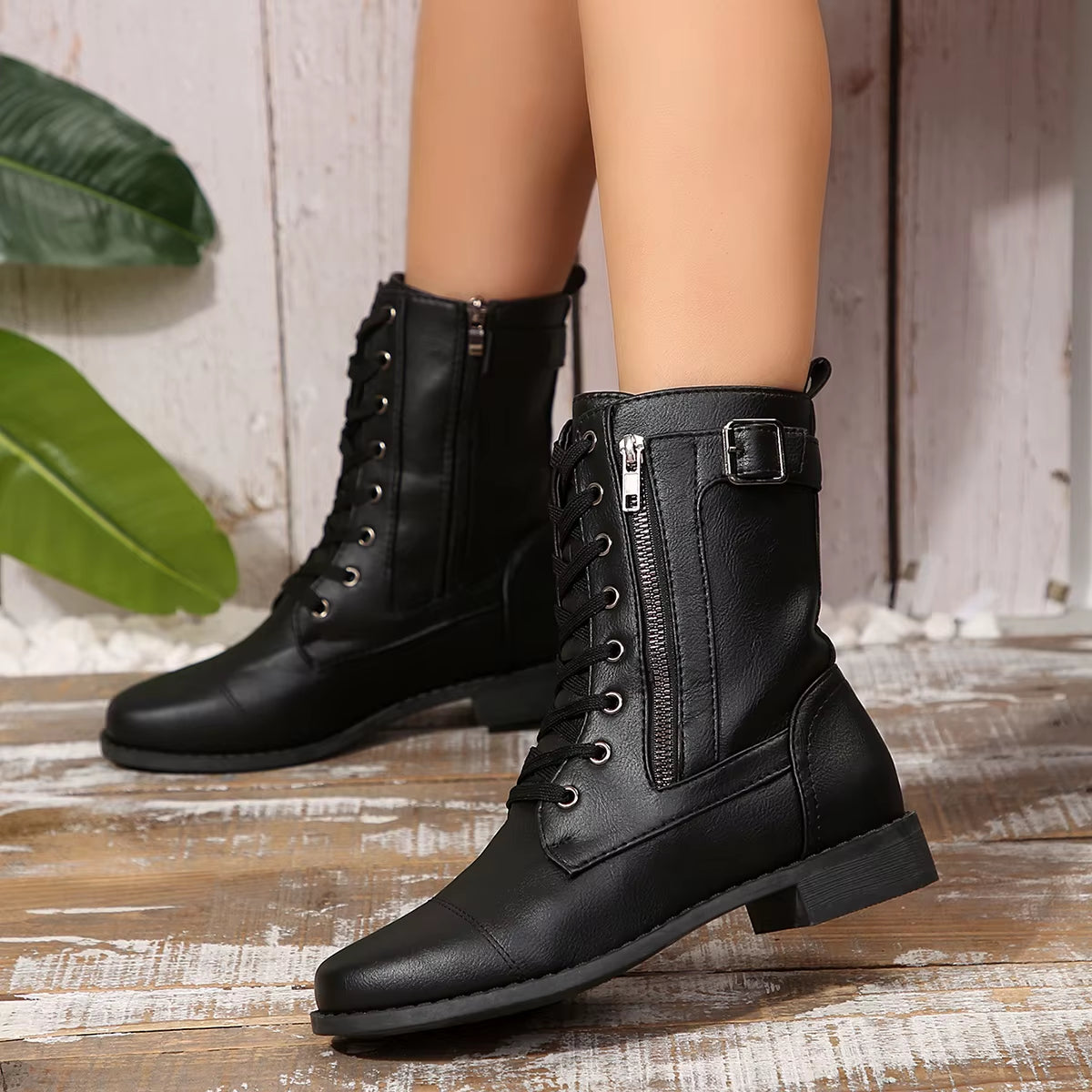 Women's black vegan leather lace-up zip boot with dual side zippers and cushioned insole