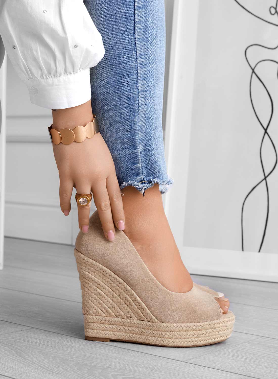 Women's suede wedge slip-on sandals in neutral tone, sleek silhouette with luxurious soft leather finish