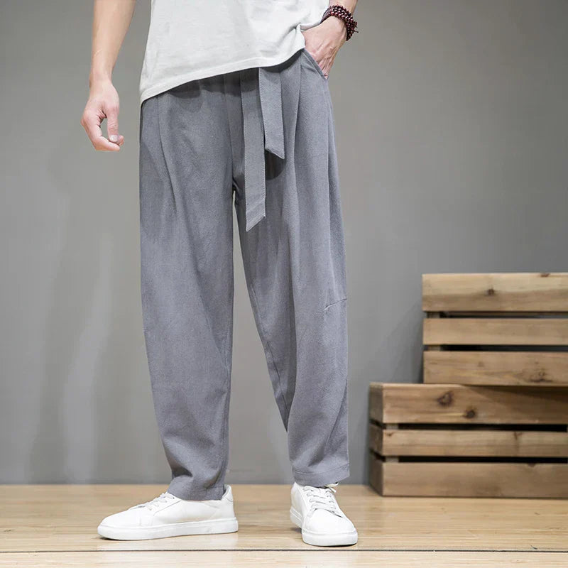 Men's beige linen relaxed-fit summer pants with elastic waist and breathable lightweight fabric