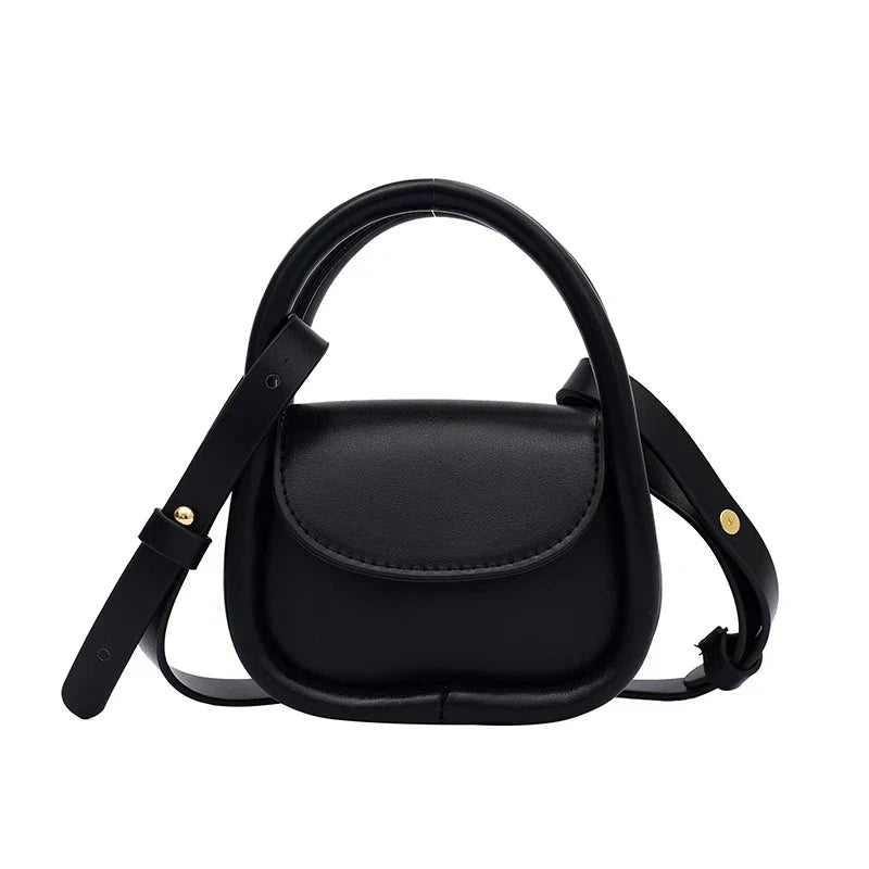 Compact genuine leather crossbody bag with snap-flap closure and adjustable strap for everyday city style