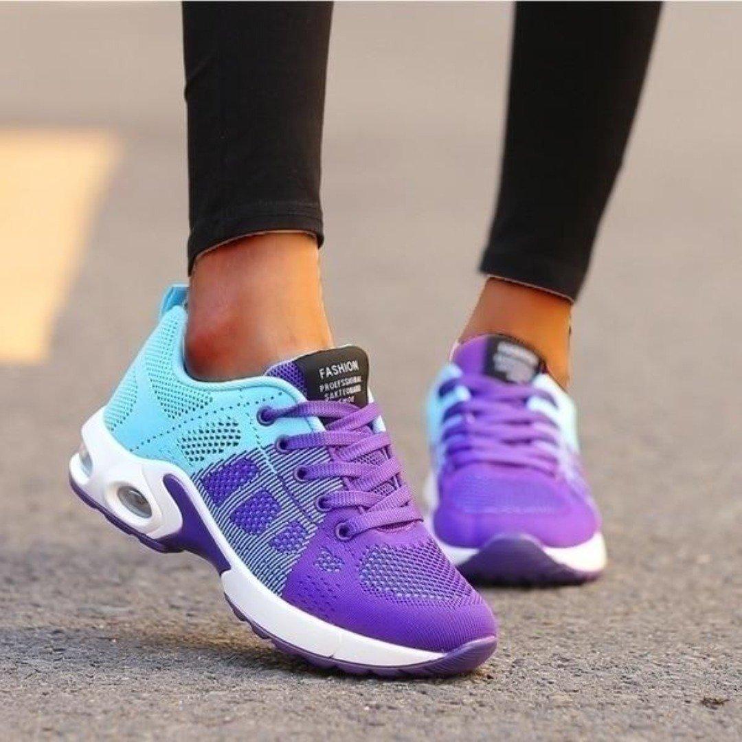 Women's athletic running shoes in bold sporty design, lightweight support with dynamic accents for active lifestyle