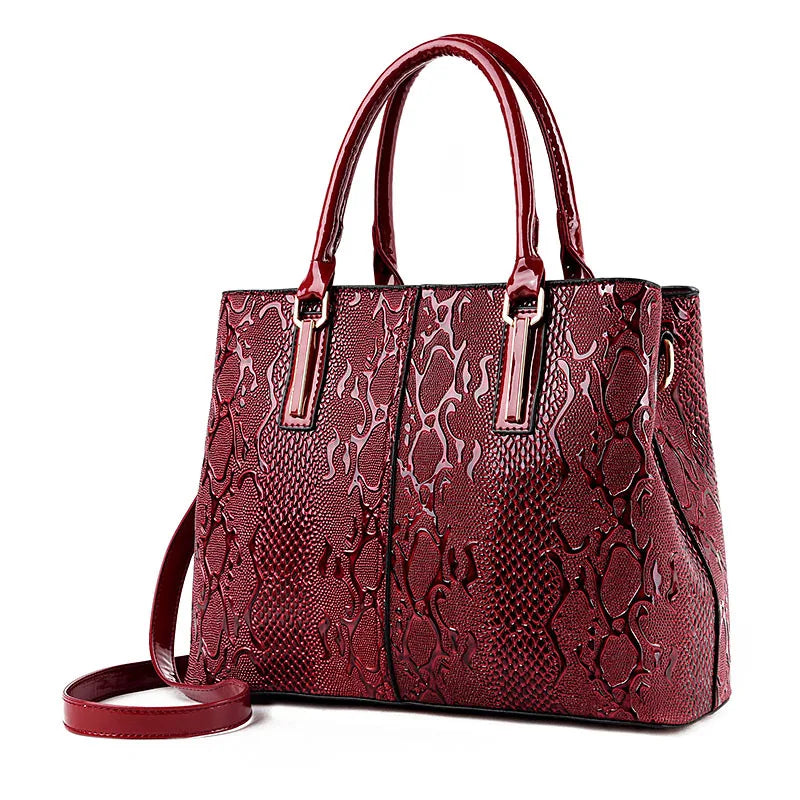 Structured boxy vegan patent leather tote with embossed crocodile snakeskin texture, sleek everyday luxury