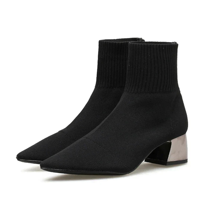 Women's knitted ankle boot slip-on style with sock-like elastic upper and chrome block heel