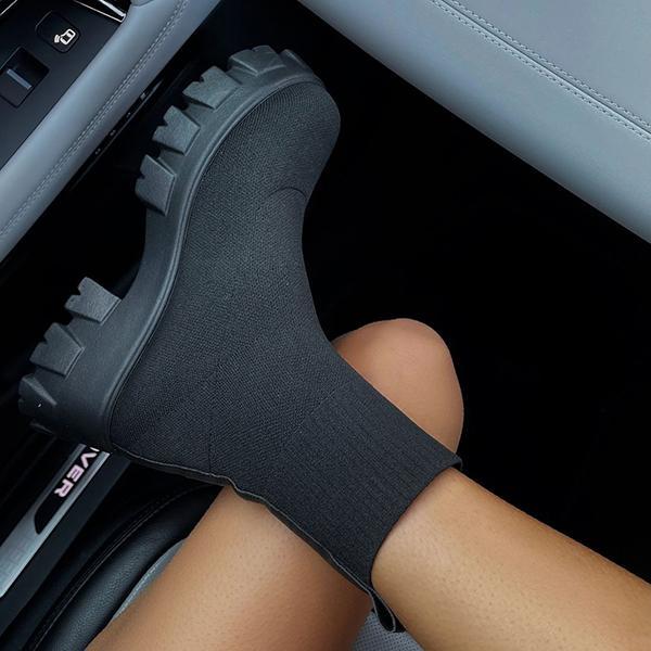 Women's black slip-on chunky heel boots with stretch upper and bold lug sole for city style
